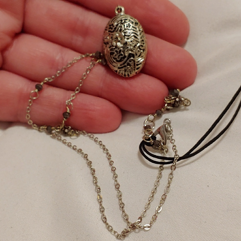 Black and metal medallion